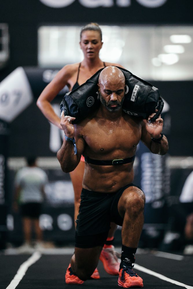 Erin Osei training — sandbag lunge